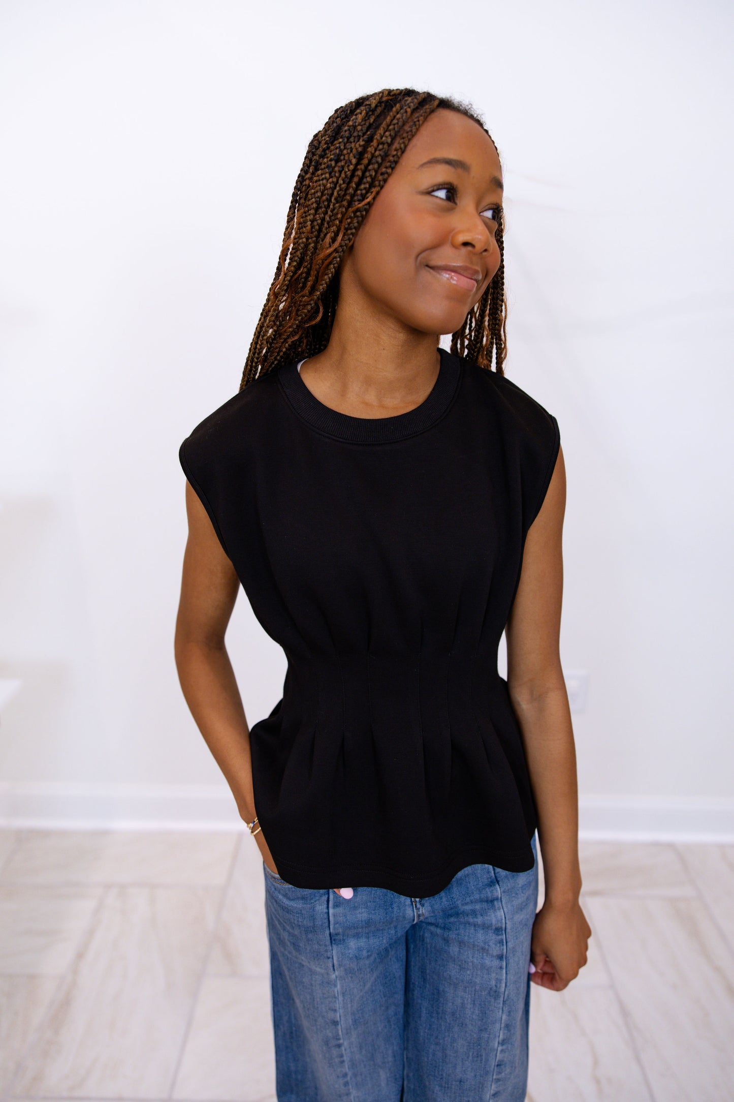 Sleeveless Top Featuring Waist Pleat Detail