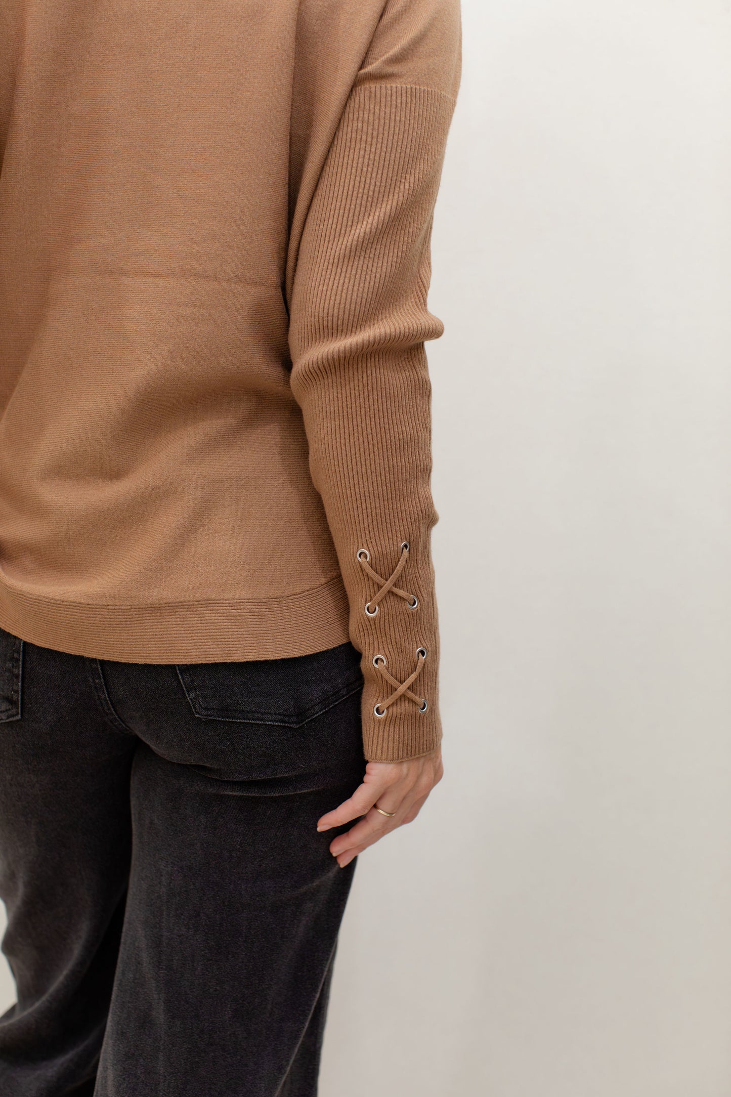 Round Hem Sweater With Front Pockets And Sleeve lacing Detail